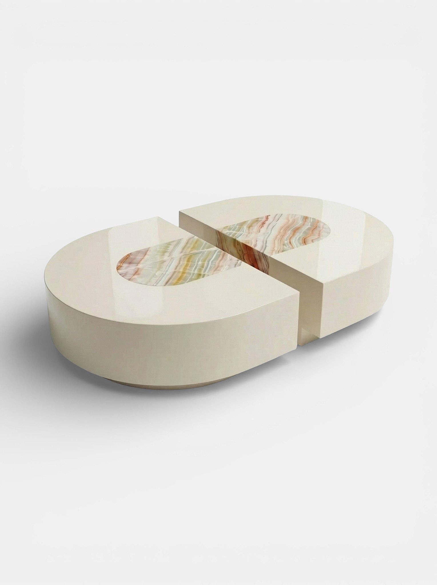 Rainbow onyx capsule coffee table side angle view displaying natural stone veining and curved silhouette