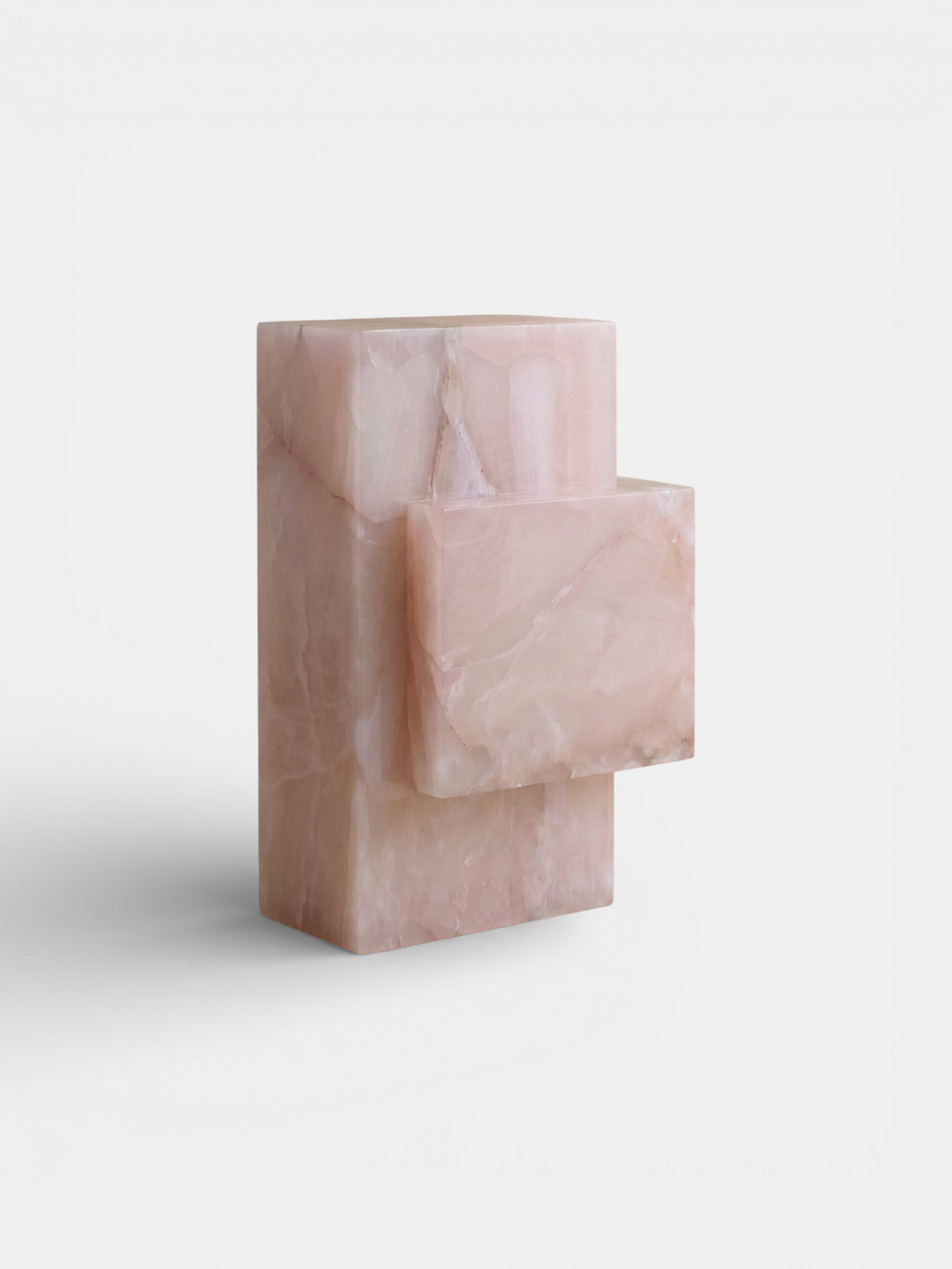 Pink onyx table right side perspective showing sculptural marble base, Italian luxury dining furniture