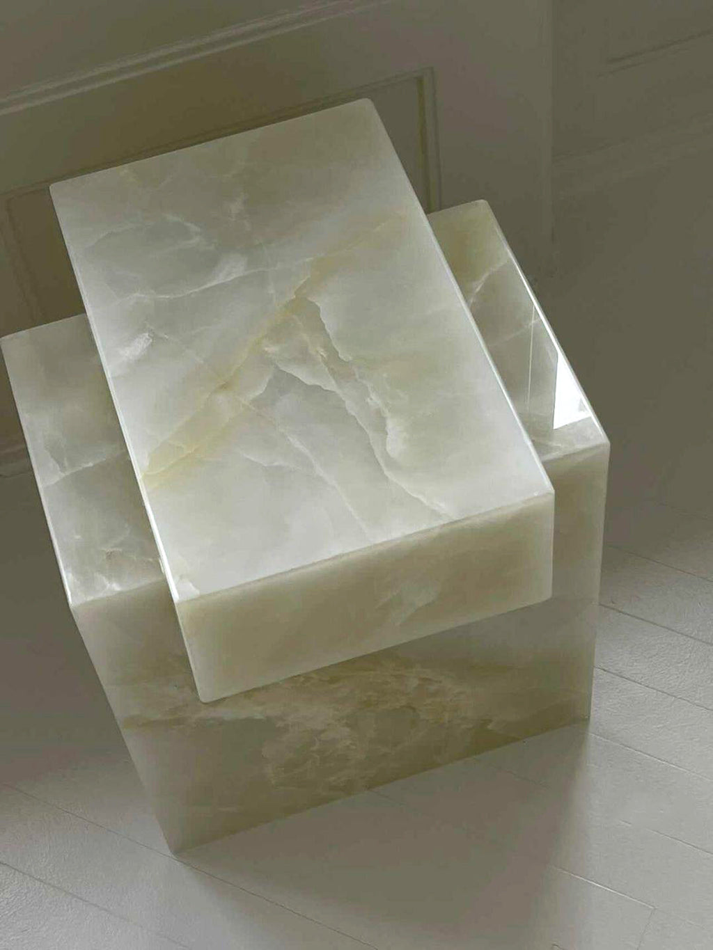 Mathilde designer showcasing Gaia white onyx marble table Italian luxury furniture craftsmanship