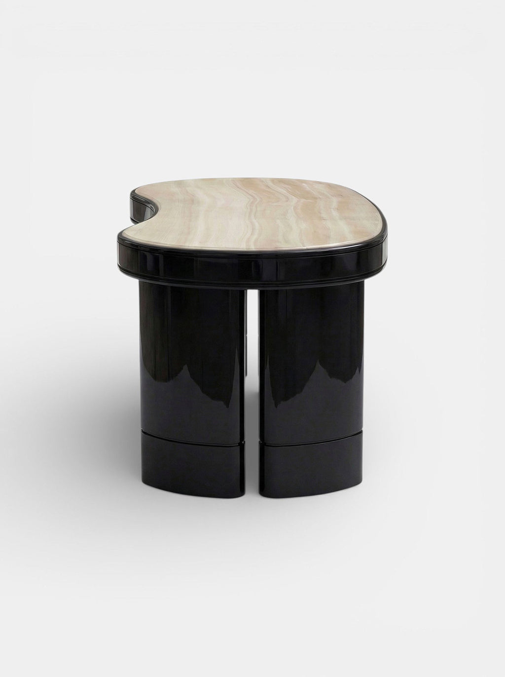 MARBERA Nicola onyx marble desk in black and ivory - side angle view highlighting sculptural form