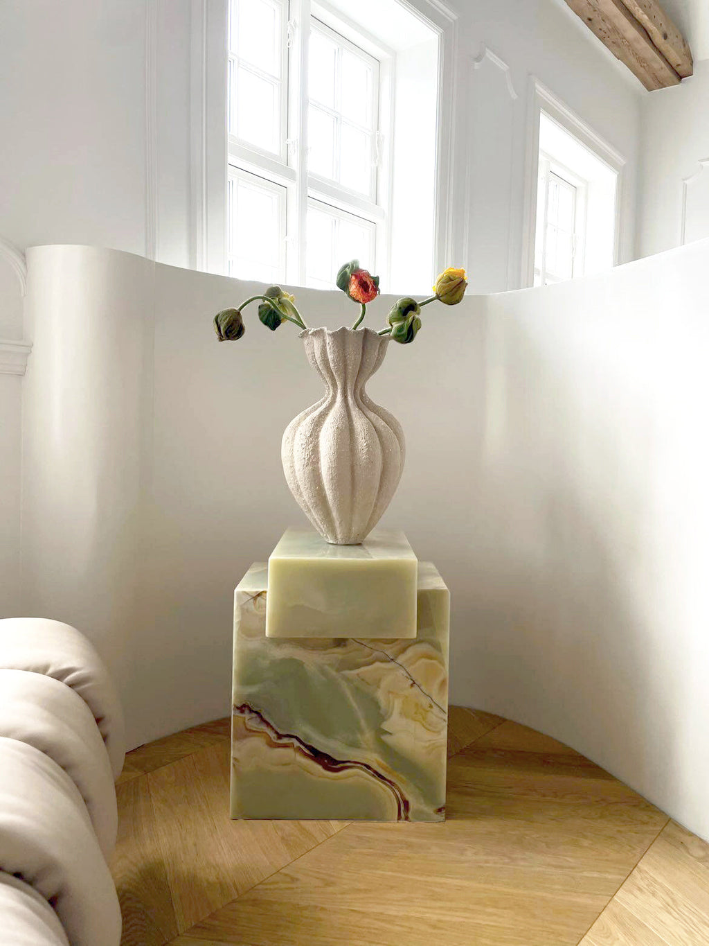 Elegant green onyx coffee table featured in sophisticated interior design with natural lighting