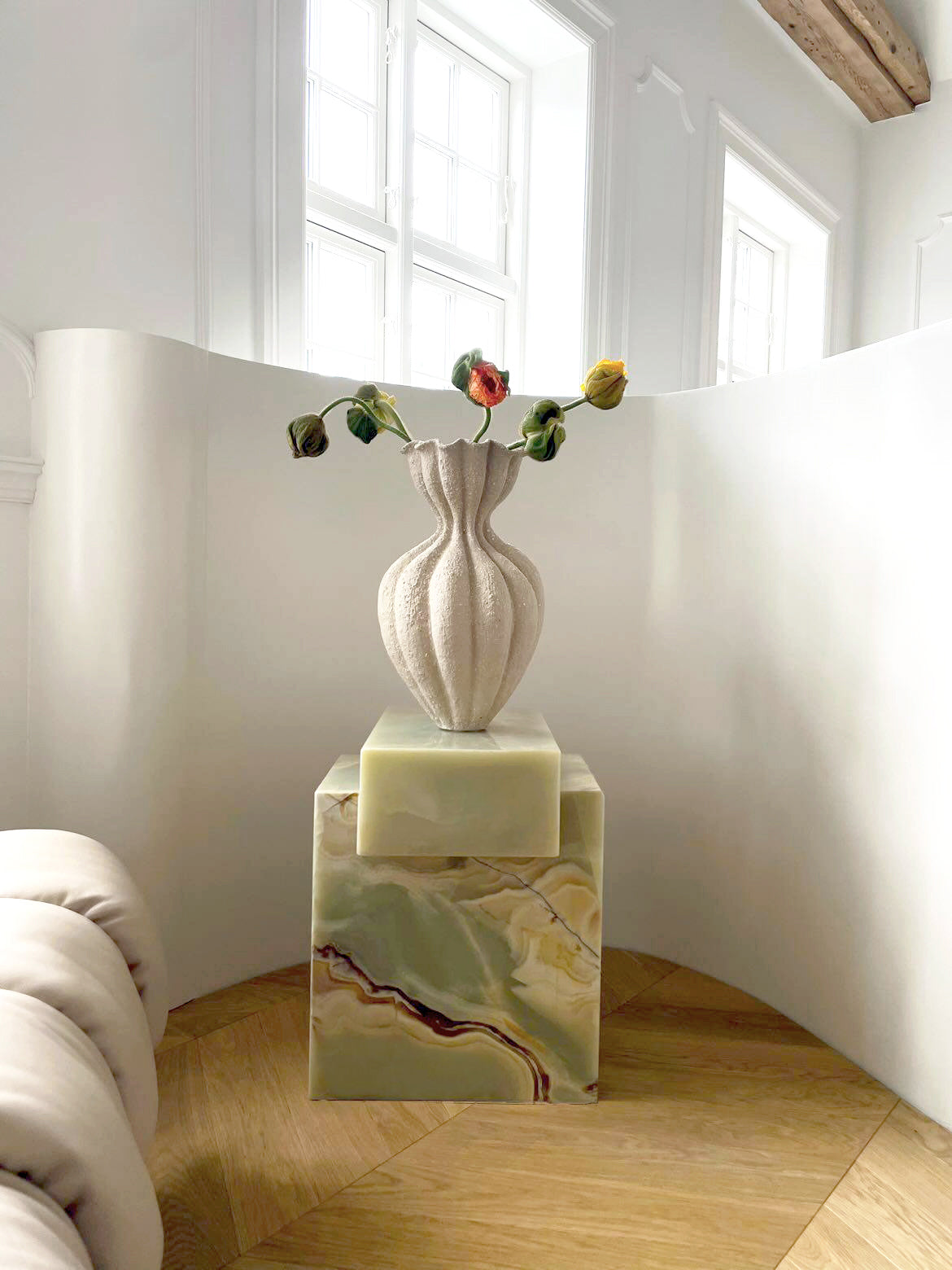 Elegant green onyx coffee table featured in sophisticated interior design with natural lighting