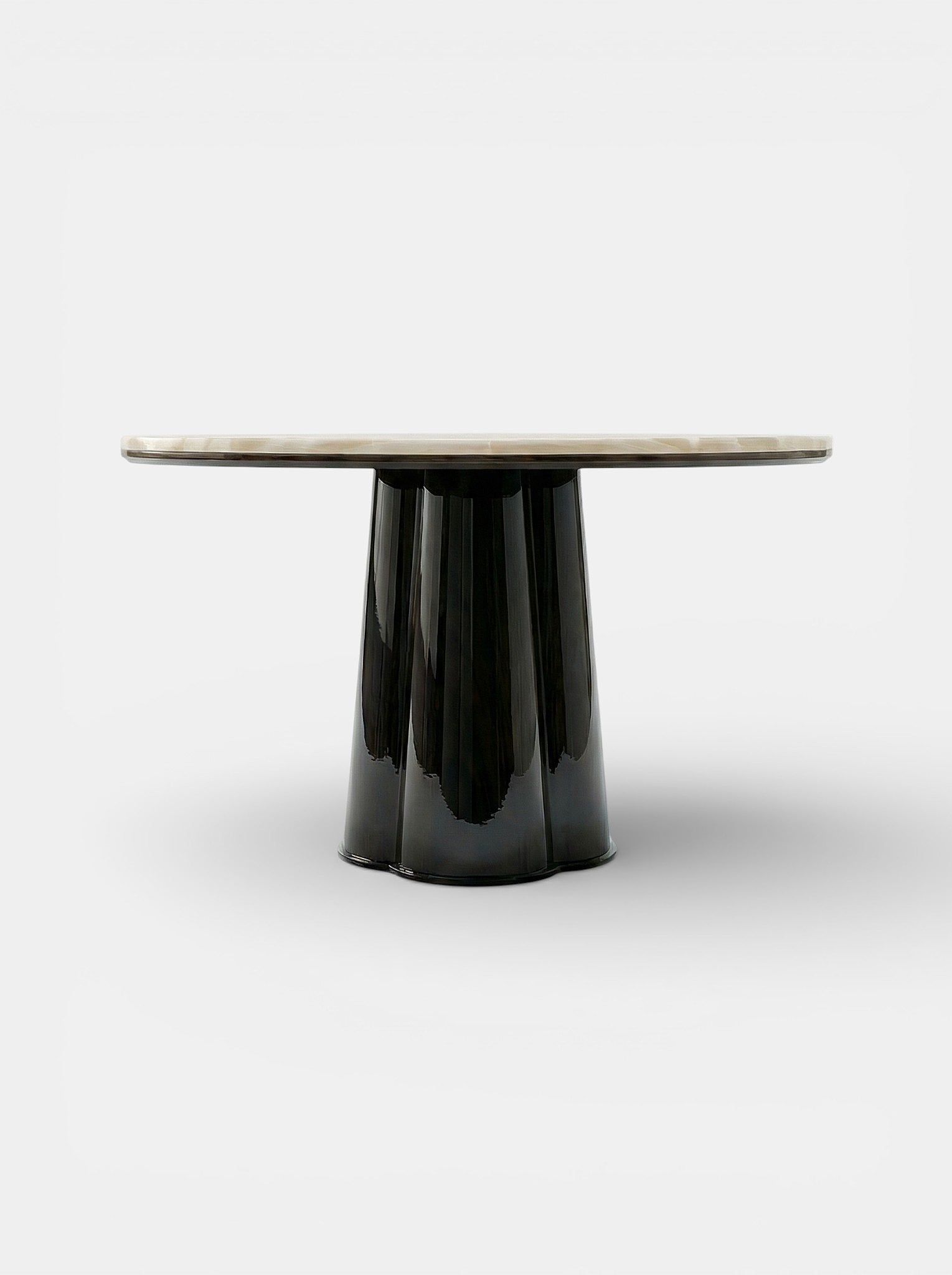 Close-up detail of Poli table showing ivory onyx marble veining with black lacquered wood base
