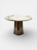 Alternative angle of Poli luxury table featuring glossy wood base with vanilla onyx marble surface