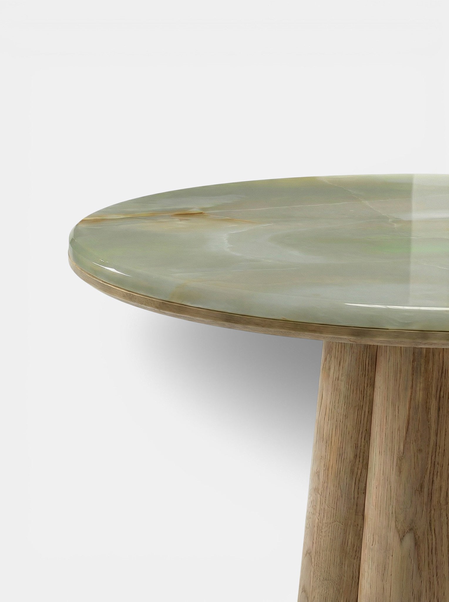 Close-up detail of green onyx marble surface on Poli table showing natural stone veining and texture