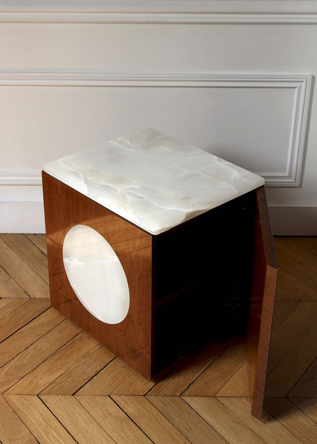 Open configuration of Rino walnut and onyx table displaying functional Italian furniture design
