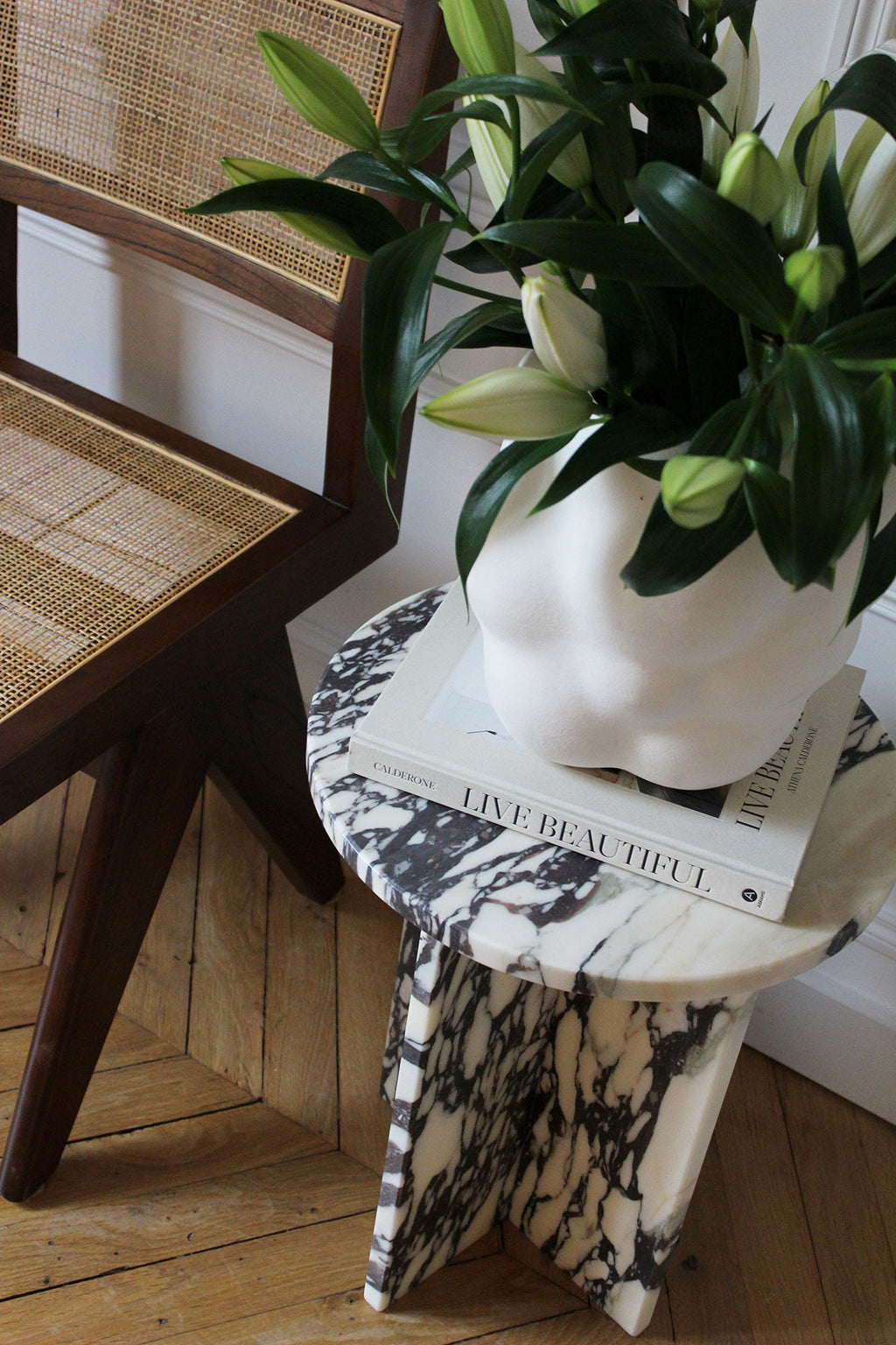 Full perspective of Rosie Calacatta Viola marble table highlighting premium Italian furniture design