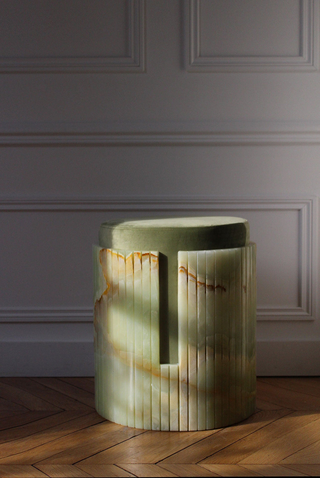 Green onyx Dolce stool side profile showing sculptural form - handcrafted Italian marble furniture