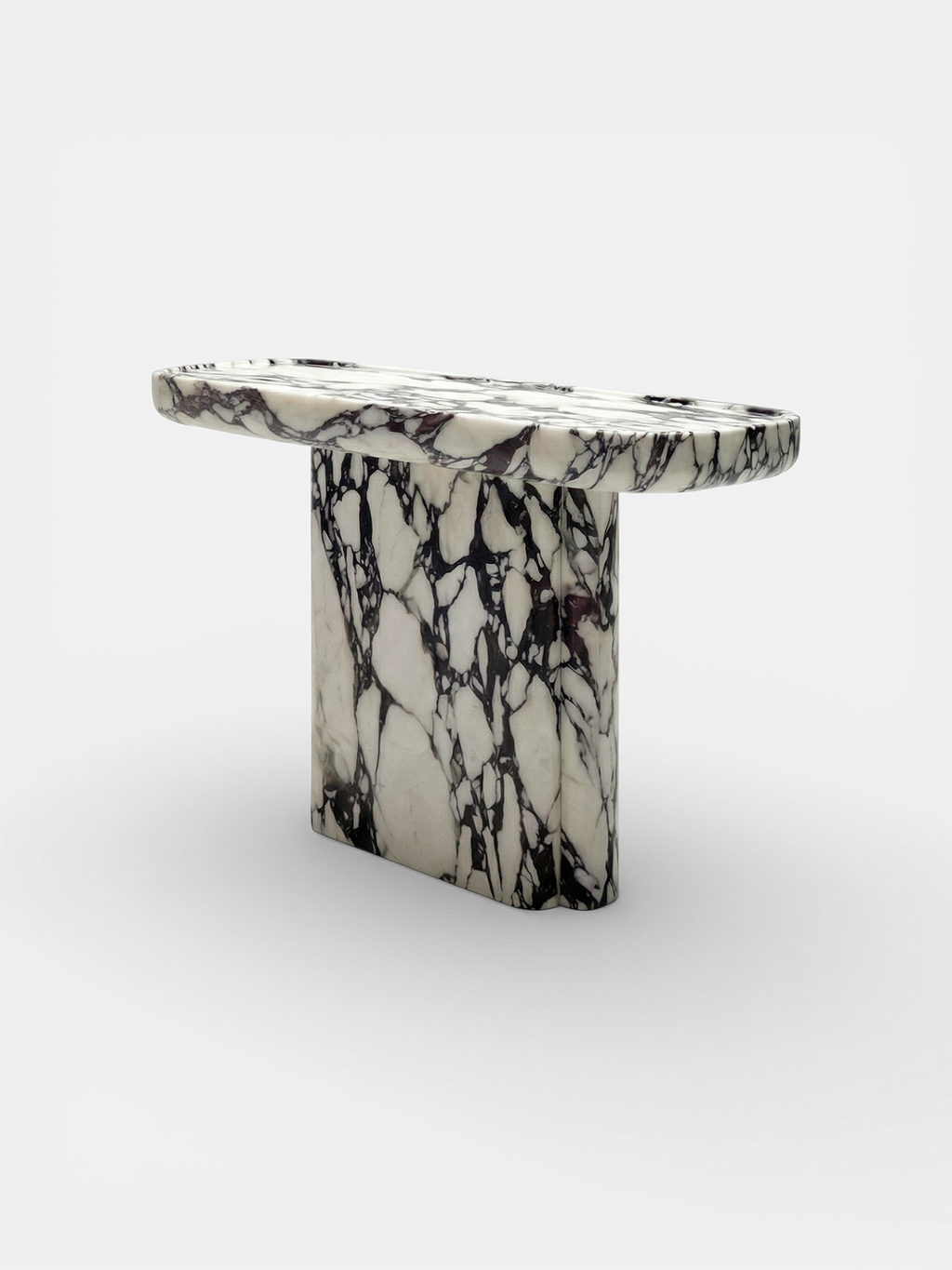 Ugo console detail showing Calacatta Viola marble patterns - premium Italian stone furniture craftsmanship