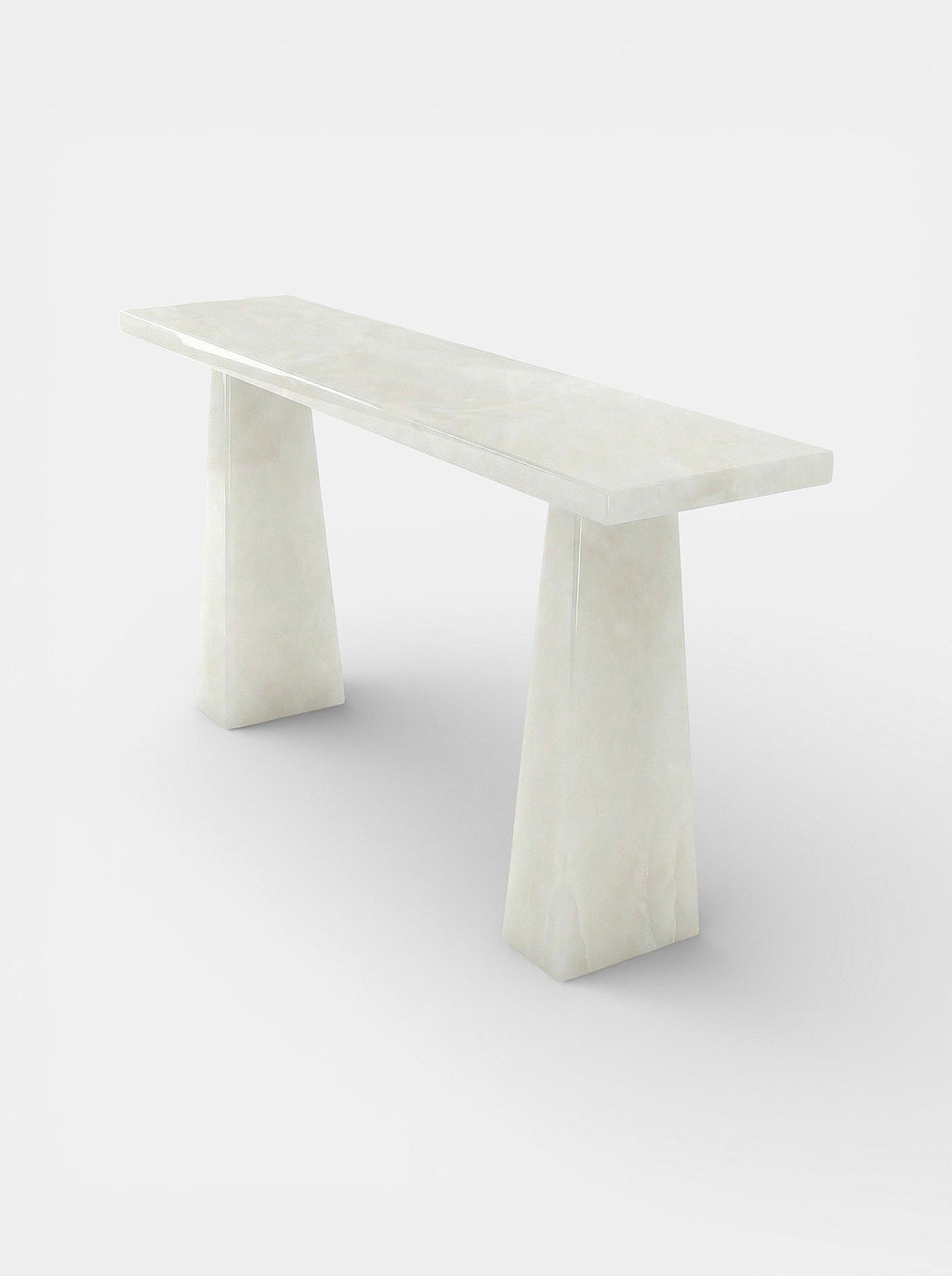 Uma White Onyx console side perspective showcasing luminous white stone texture and craftsmanship