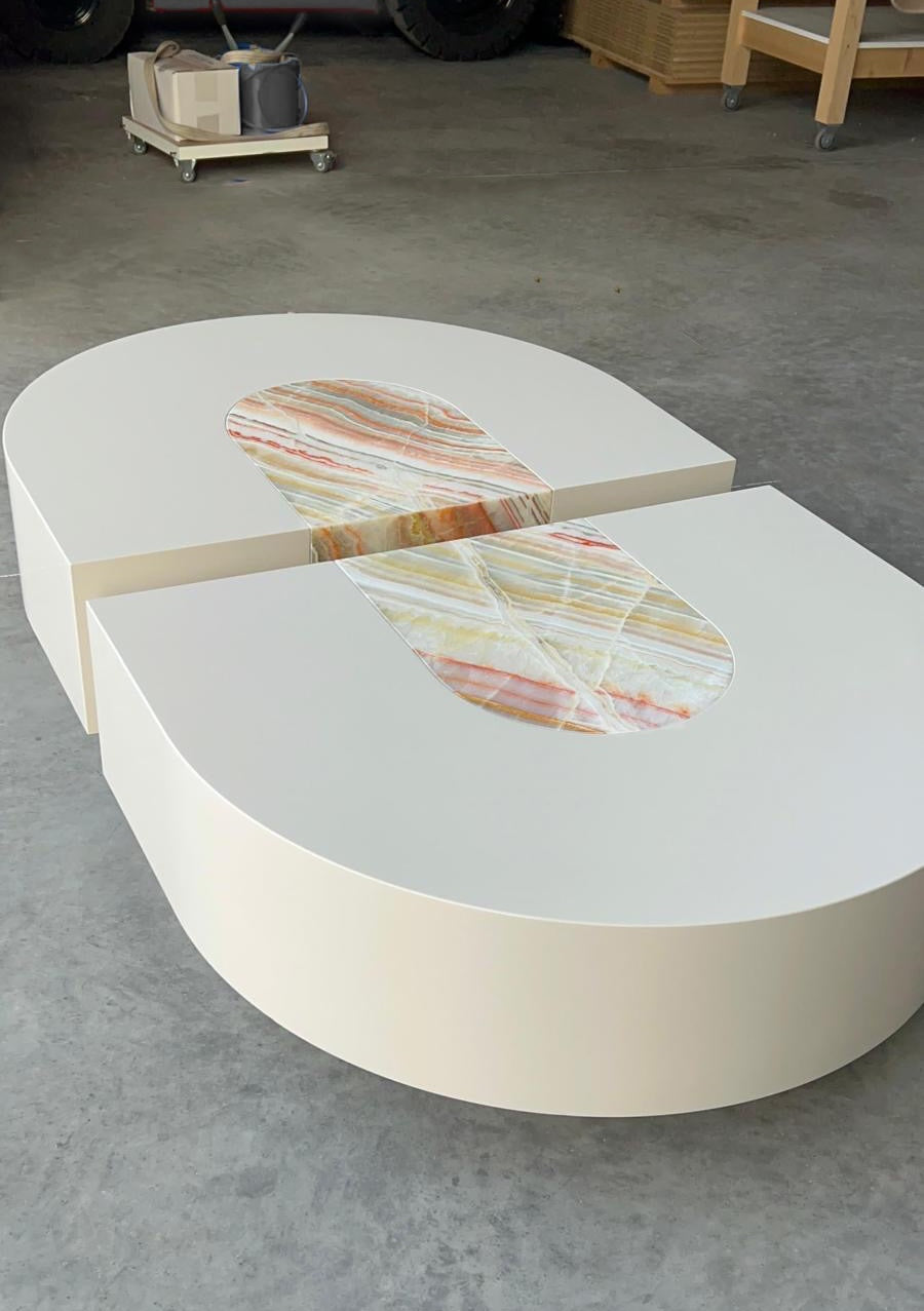 Close-up detail of rainbow onyx marble texture on luxury Italian Baci capsule coffee table