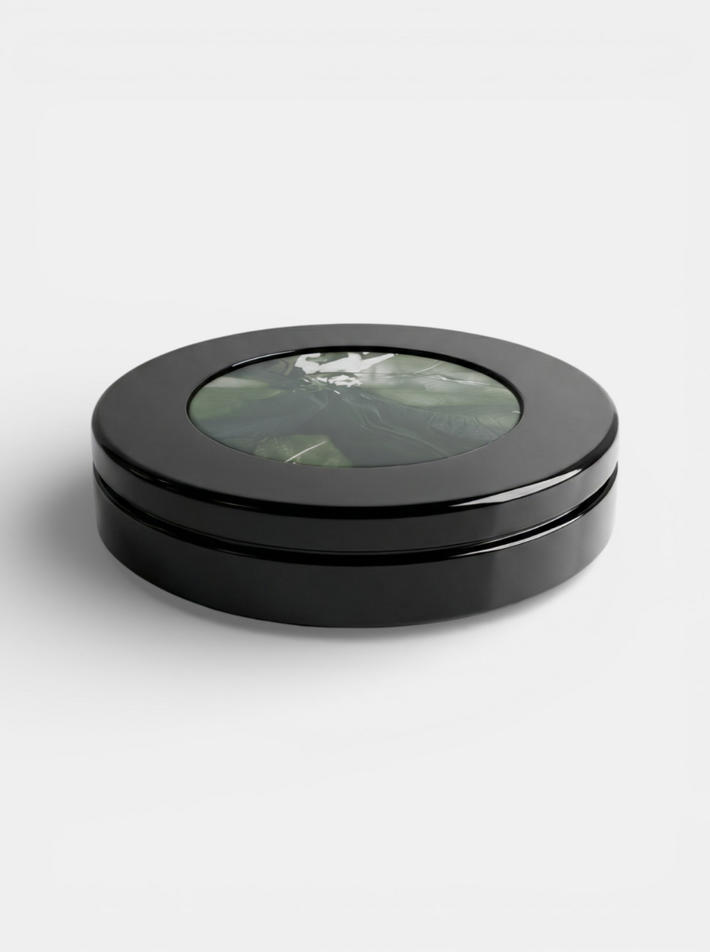Two-tone marble table combining black and green avocado stone - contemporary Italian design